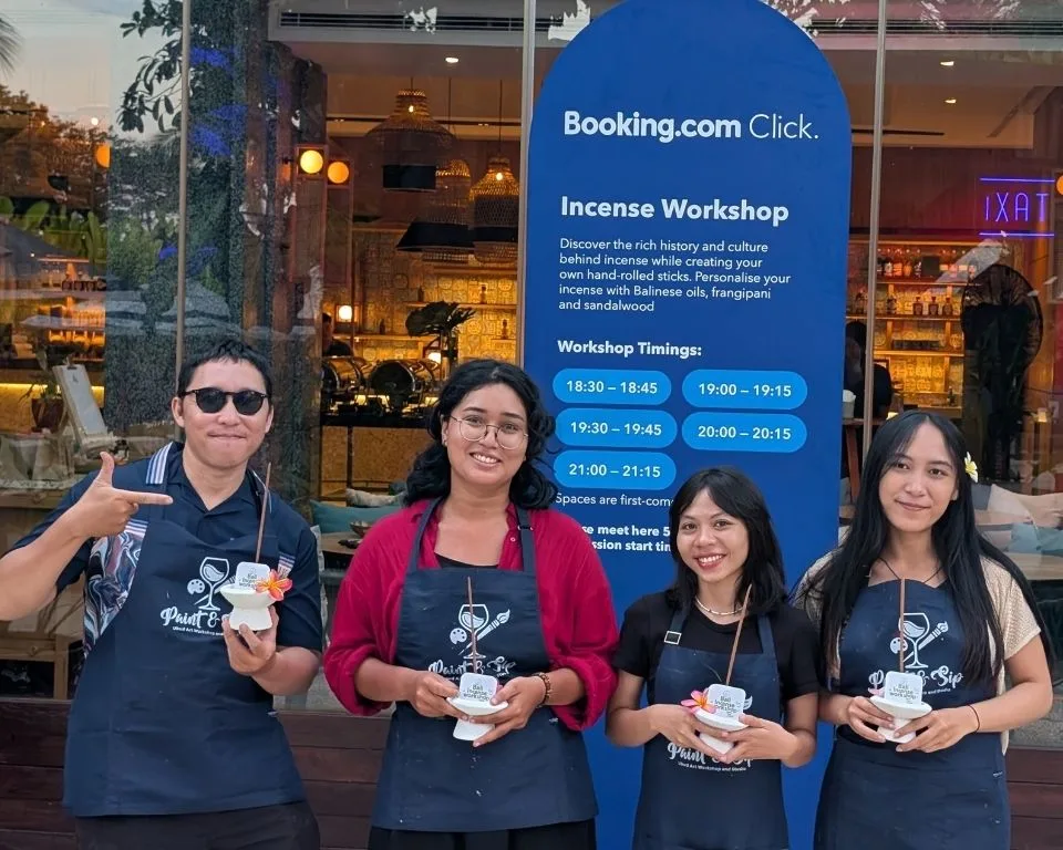 Guests holding their incense at a Booking.com event