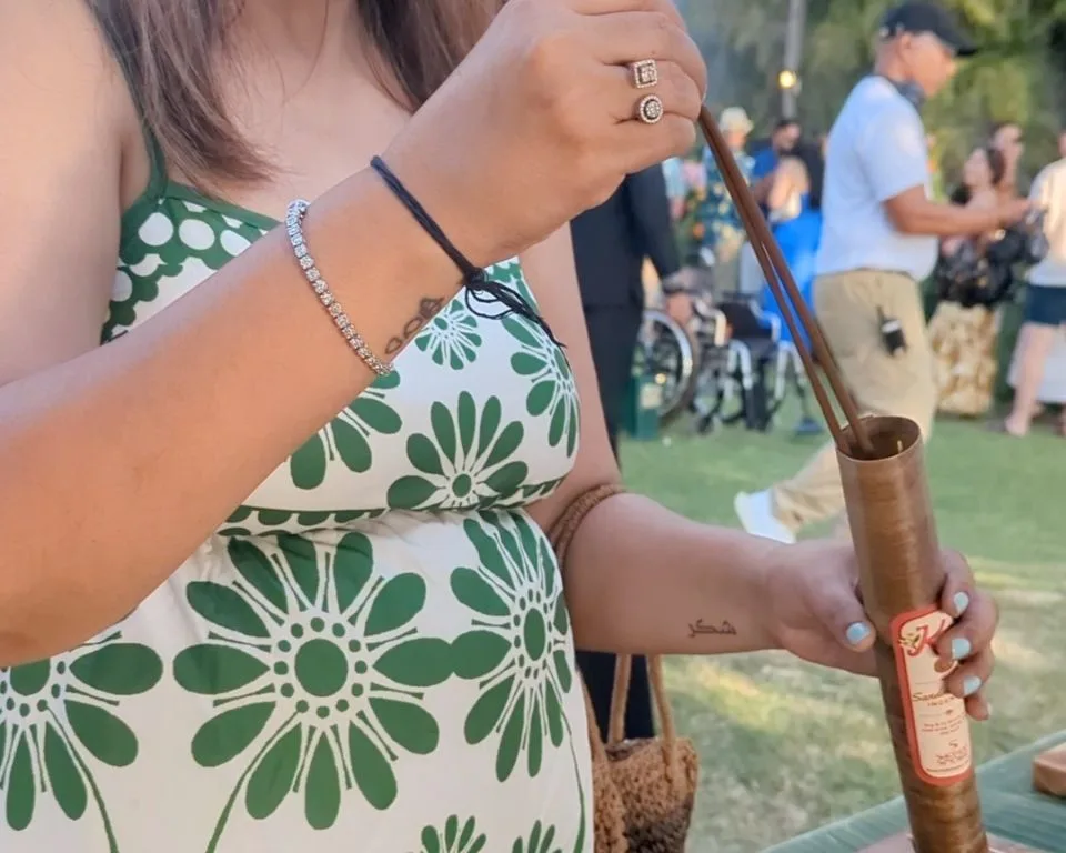 A guest packing her handmade incense into a tube