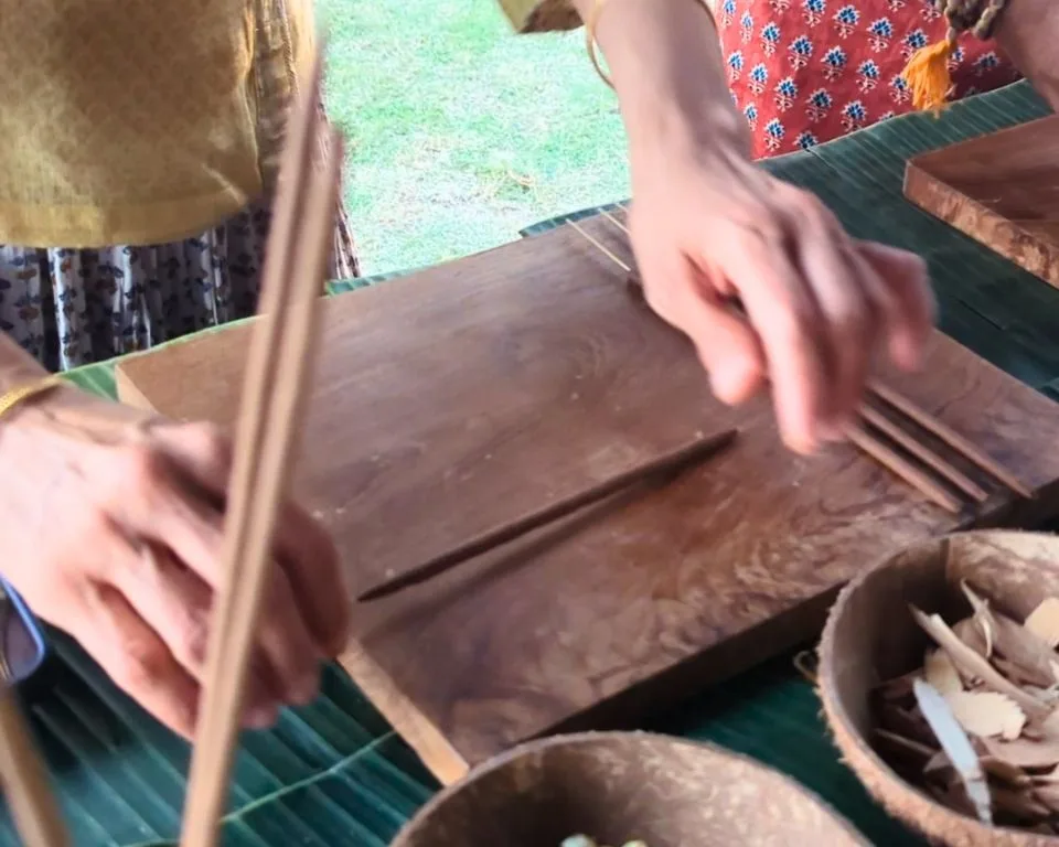 Hands practicing the palm technique on a wooden rolling board