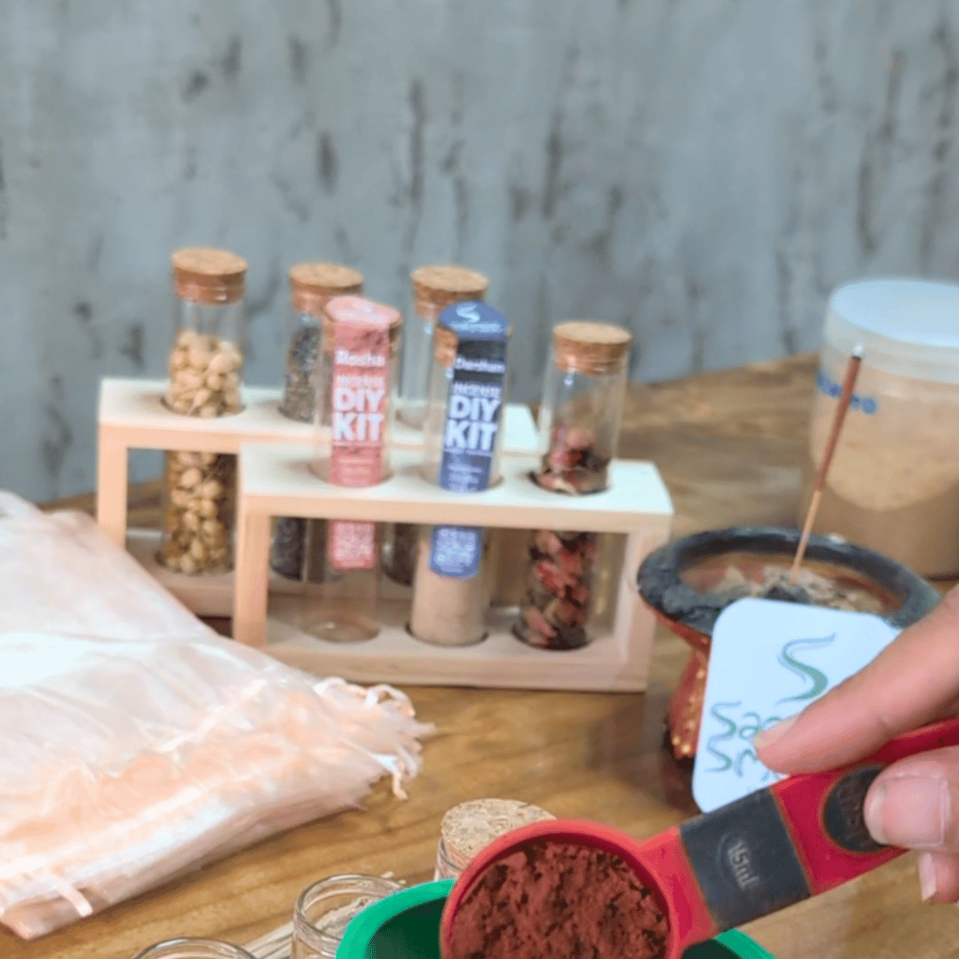 Rosha incense powder being measured into a kit vial