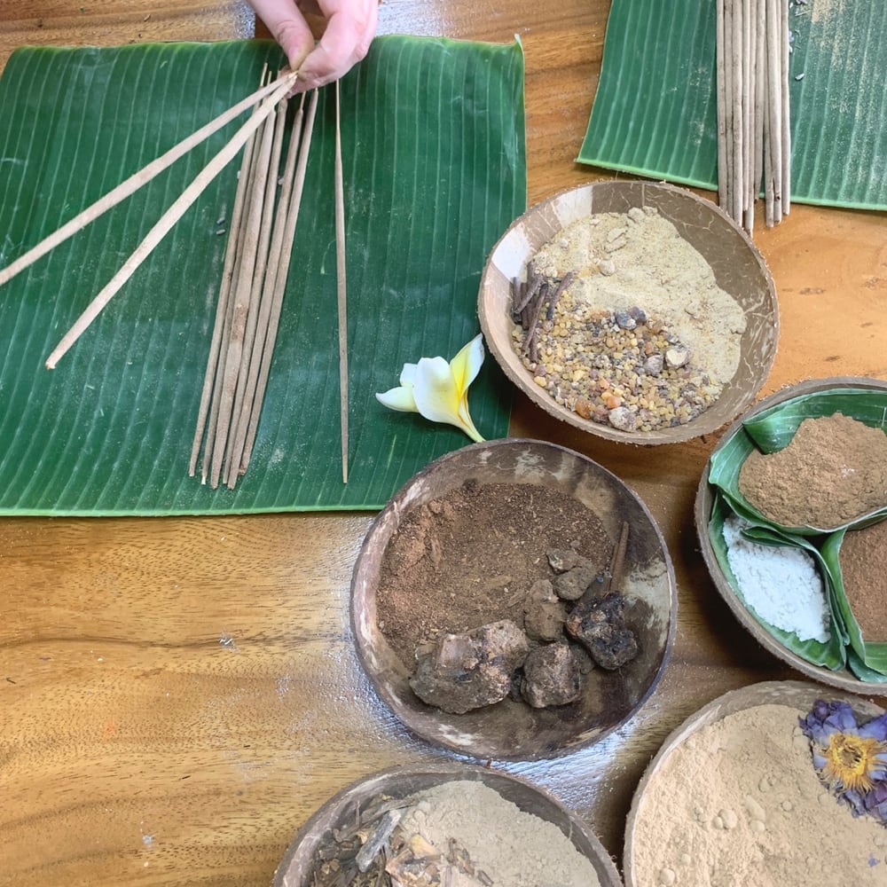 Incense ingredients and handmade sticks on banana leaves