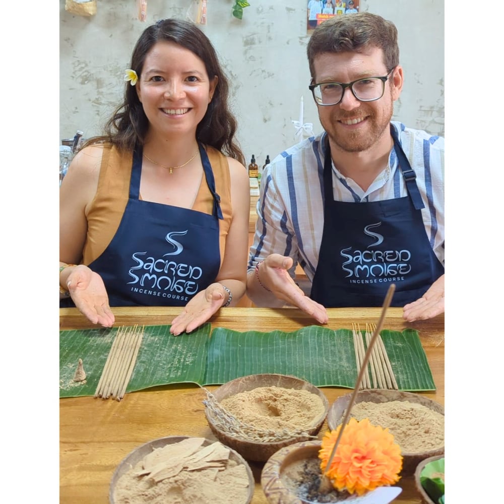 Couple wearing Sacred Smoke aprons with finished incense sticks