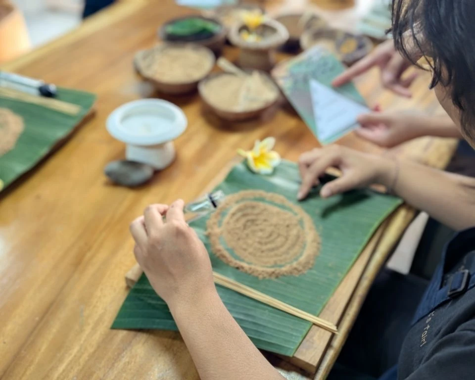 Guest coating handmade incense sticks with botanical powder