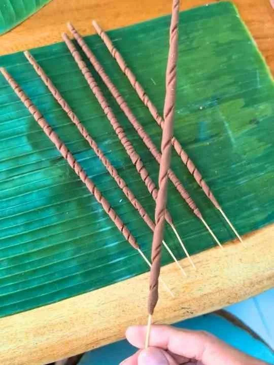 Hand-shaped incense sticks with artisan texture