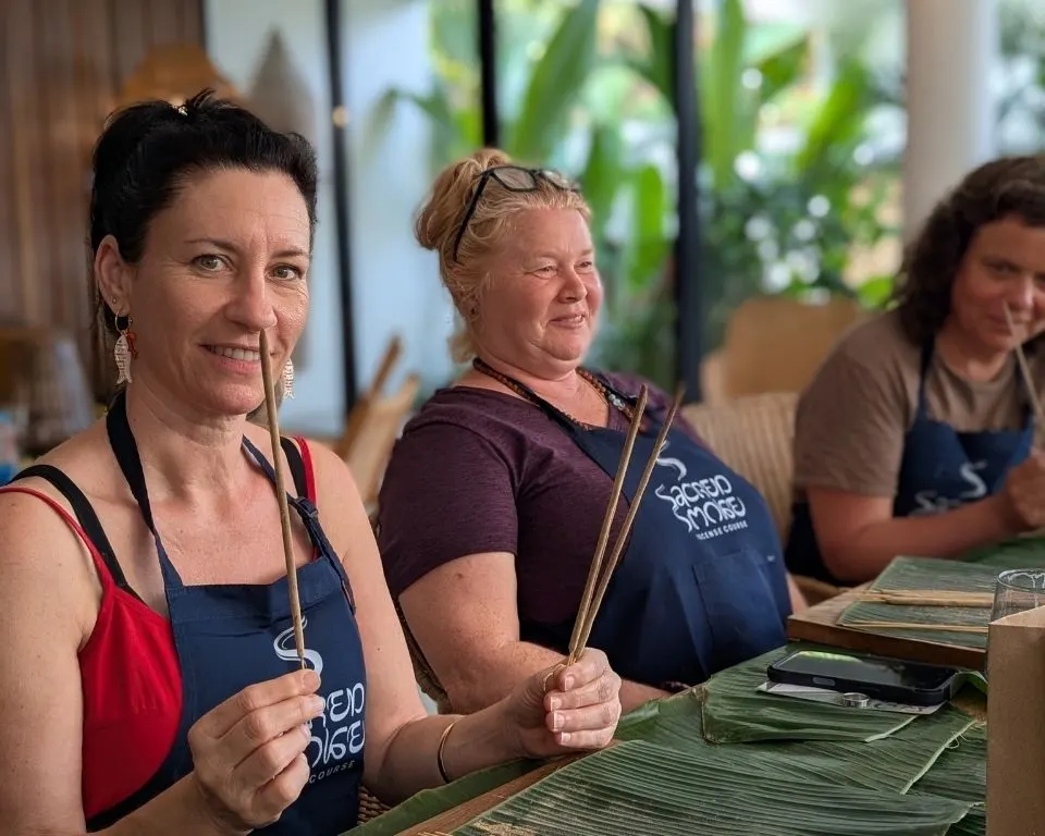 Guests holding incense sticks during the workshop